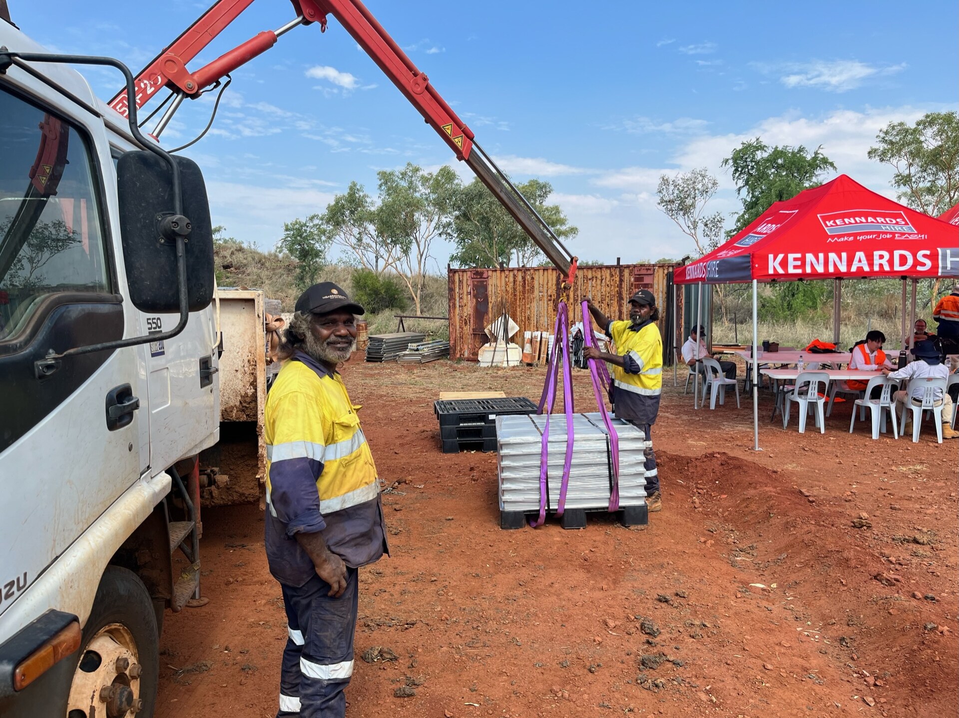 Ngarranggarni Civil and Mining crew loading materials with a crane truck on a Kimberley worksite